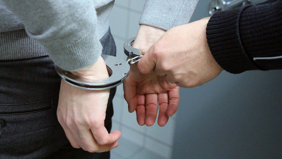 Man Put into Hancuffs
