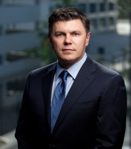 Attorney Roman Kostenko smiling at camera