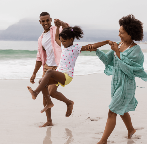 A black family enjoying the day at the beach