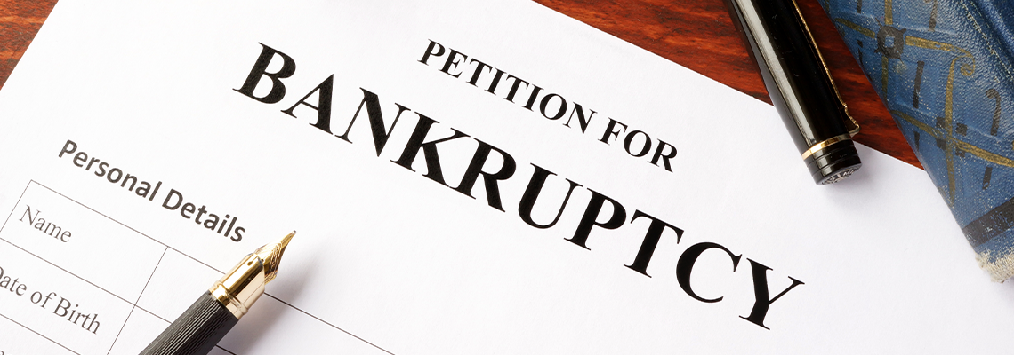 Petition for Bankruptcy on an office table with pen
