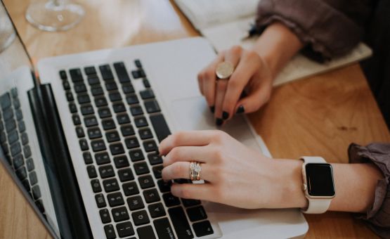 Woman typing at her computer