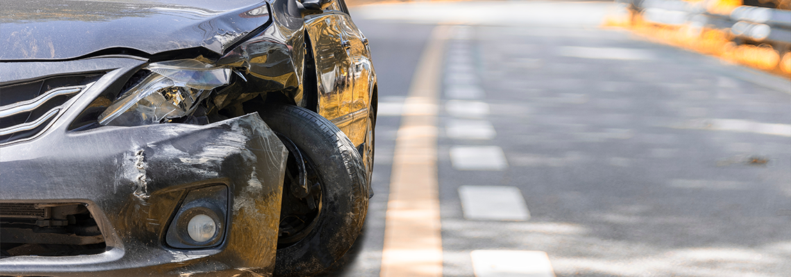 Damaged vehicle on road